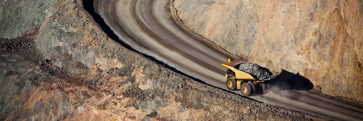 A mining machine carrying earth through site
