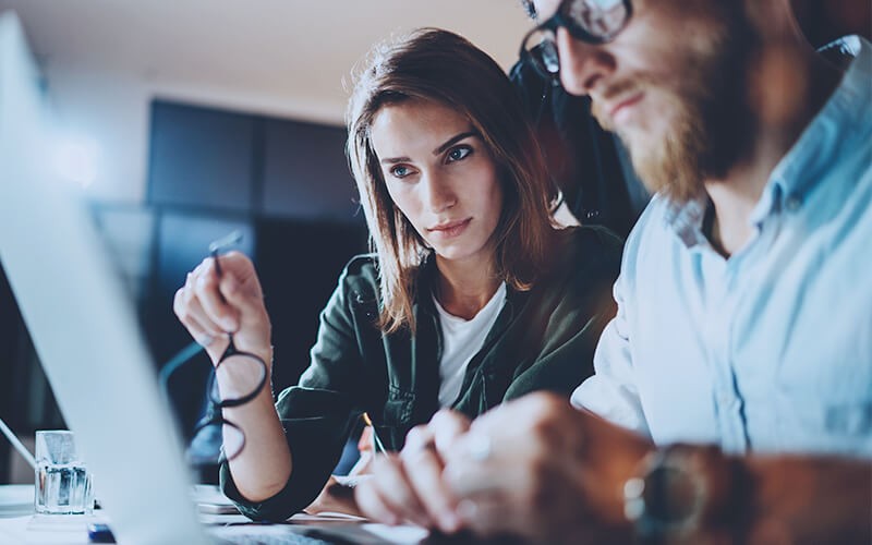 Cisco eliminates a variety of threats in the network while balancing the user experience Professionals sharing ideas using laptop