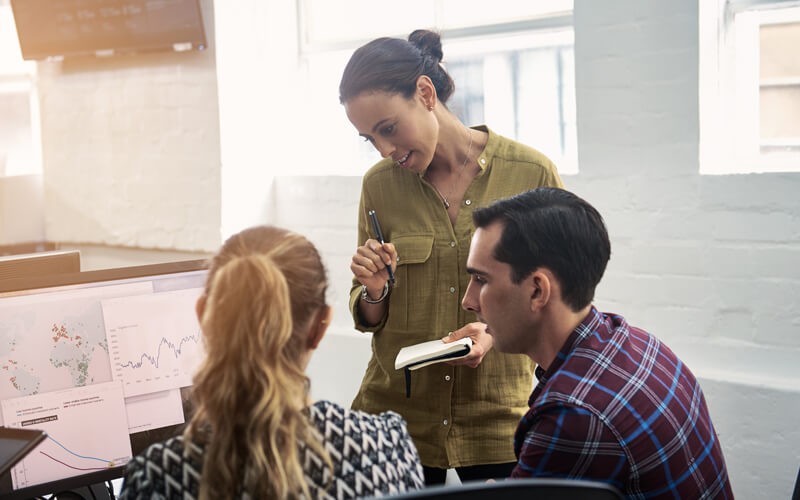 Three employees collaborating 