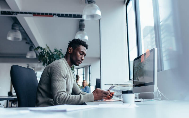 Man working on mobile device