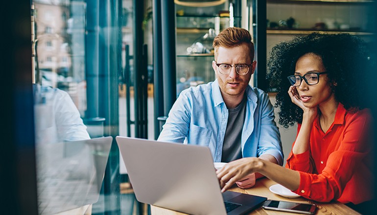 Empower your team with the right tools Businessman meets with businesswoman over cloud tablet devices