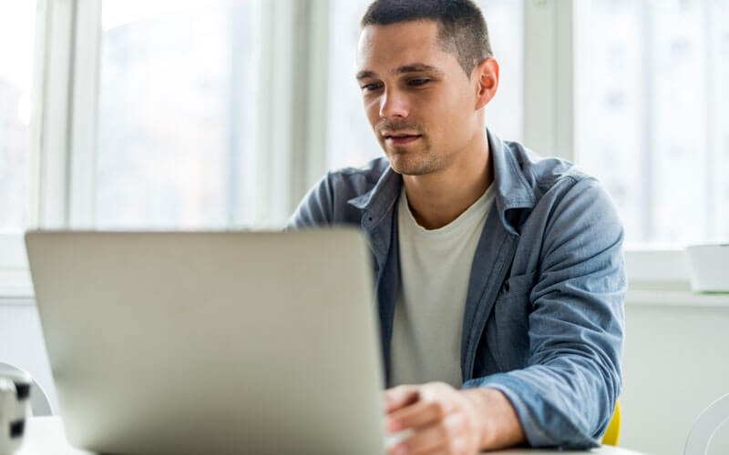 Man working on laptop device