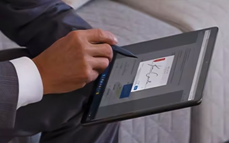 Group of colleagues working on cloud security with tablet device and computer