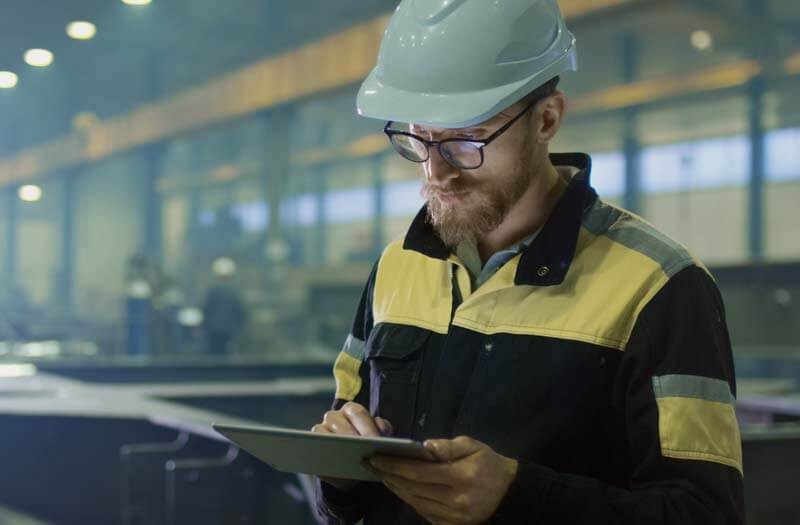 Engineer using modern apps on smart device