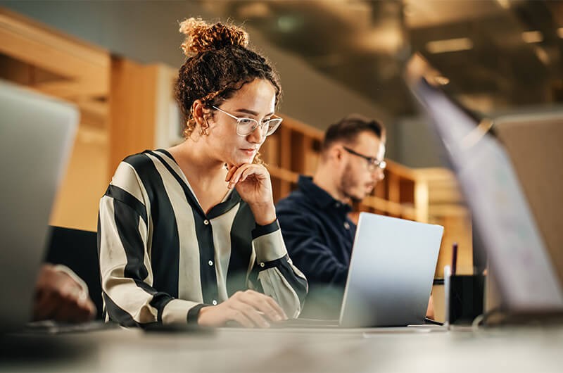 Insight’s migration services help you safely and securely move workloads with minimal disruption Network engineer in server room