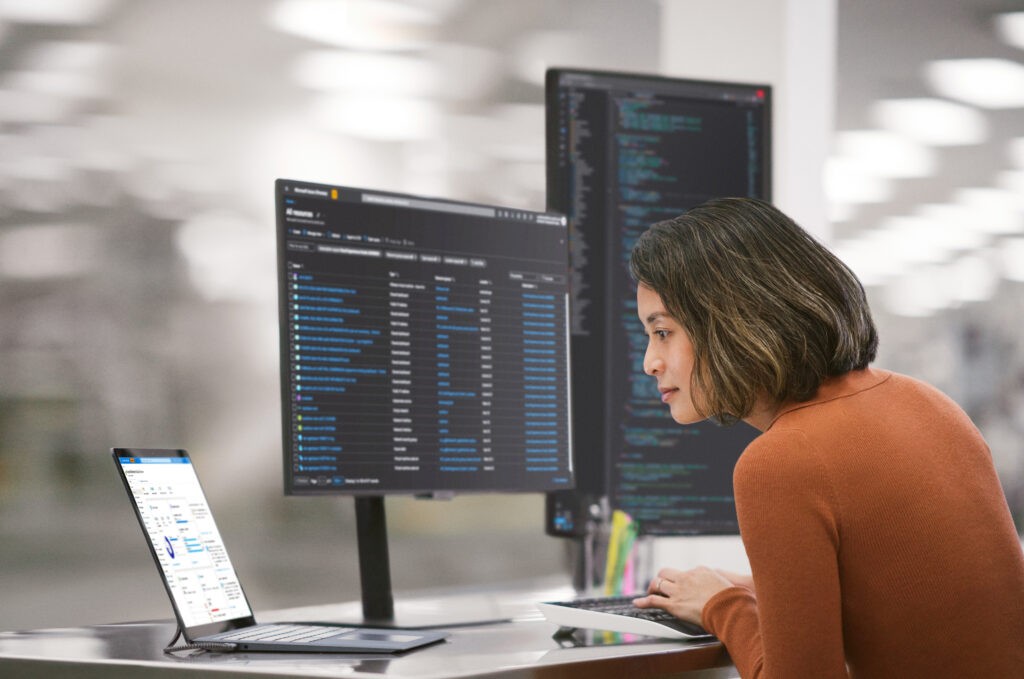 Equip your business for current and future challenges Team collaborating around desktop computer