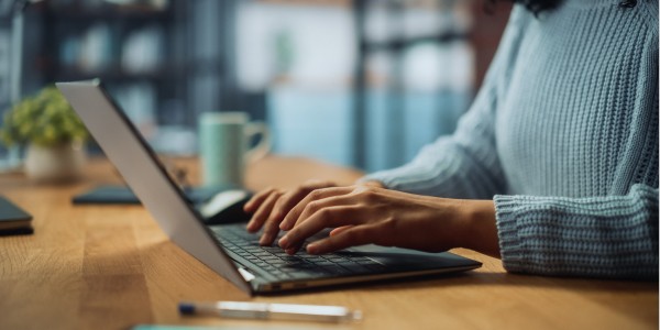 Business man working on workforce applications on desktop computer